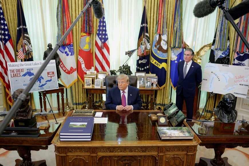 U.S. President Donald Trump, with U.S. Secretary of the Interior Doug Burgum, speaks to the media after signing an executive order renaming Lake Ontario as Lake America at the Oval Office of the White House in Washington, D.C., U.S., August 27, 2026. REUTERS/Evan Vucci