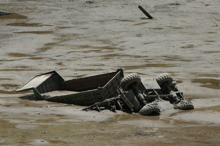 A construction vehicle is buried in the mud following flash floods and a mudslide in Galchhi, Nepal, August 27, 2026. REUTERS/Francis Mascarenhas