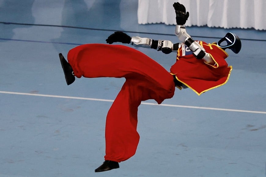 A humanoid robot by Unitree Robotics competes during a Wushu contest at the 2026 World Humanoid Robot Games at the National Speed Skating Oval in Beijing, China August 26, 2026. REUTERS/Tingshu Wang