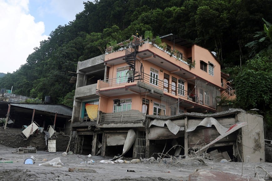 A man inspects his house after it was damaged during flash floods and a mudslide at Trishuli Bazaar, Nuwakot, Nepal, August 28, 2026. REUTERS/Francis Mascarenhas