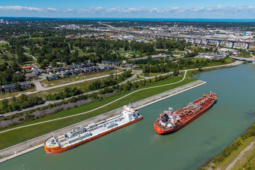 The oil and chemical tanker Octonaut passes the cement carrier Tamarack on the Welland Canal, which links Lake Ontario and Lake Erie entirely within the Canadian province of Ontario, a day after U.S. President Donald Trump signed an executive order renaming Lake Ontario as "Lake America," in St. Catharines, Ontario, Canada, August 28, 2026. REUTERS/Carlos Osorio.