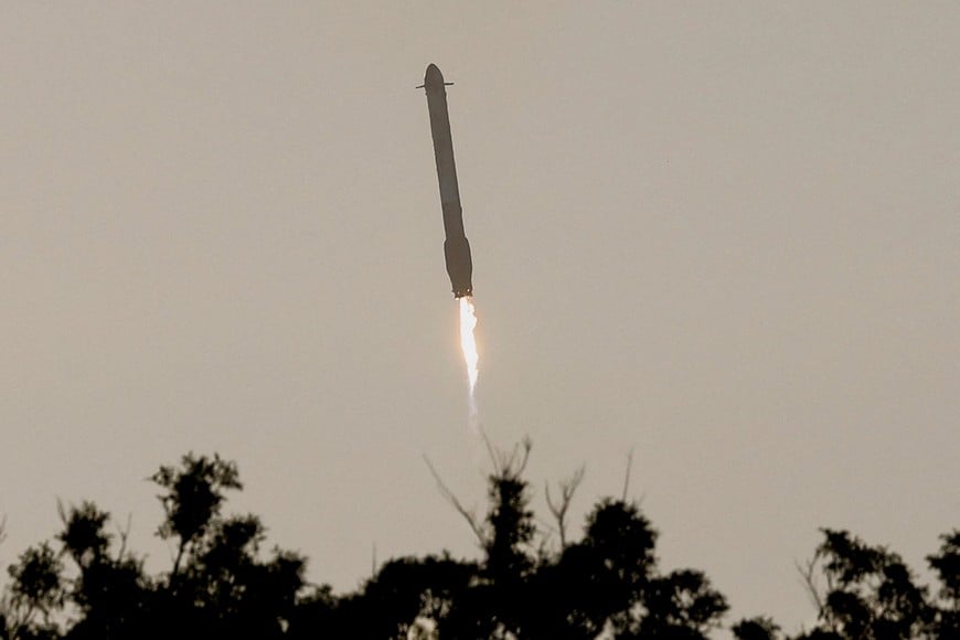 One of two boosters returns to earth after the launch of a SpaceX Falcon Heavy rocket carrying NASA's Nancy Grace Roman Space Telescope, at the Kennedy Space Center in Cape Canaveral, Florida, U.S., August 30, 2026. REUTERS/Joe Skipper