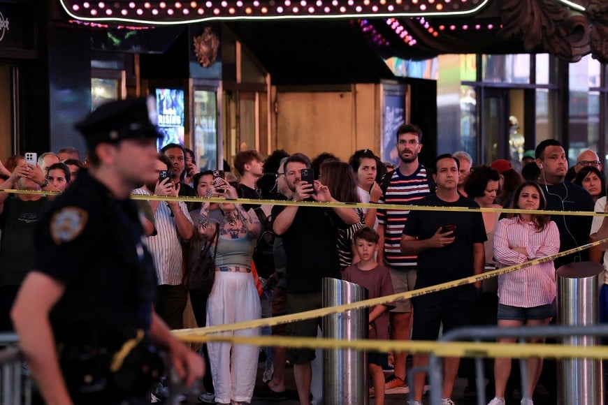 People gather as NYPD Commissioner Jessica Tisch and New York City Mayor Zohran Mamdani hold a press conference at the scene of an officer-involved shooting, in Times Square, New York City, U.S. August 31, 2026. REUTERS/Brendan McDermid TPX IMAGES OF THE DAY