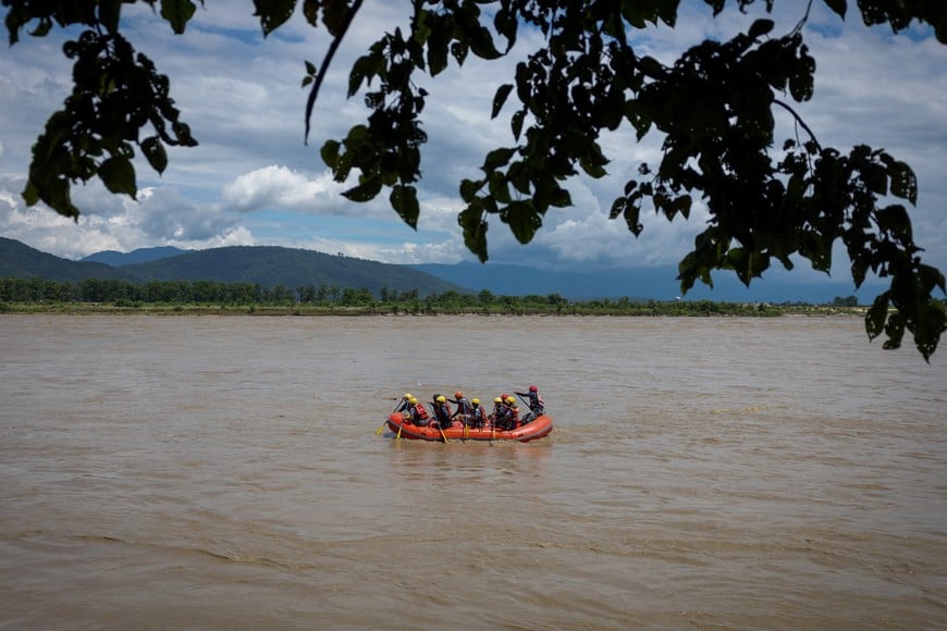 Members of the Armed Police Force (APF) conduct a search operation for bodies washed away by flash floods and a mudslide, in the Narayani River, Chitwan, Nepal, September 1, 2026. REUTERS/Adnan Abidi