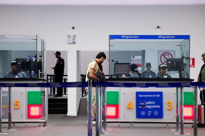 A person goes through migration control as commercial flights resume at Simon Bolivar International Airport after it was damaged by the June 24 earthquakes, in Maiquetia, Venezuela, September 1, 2026. REUTERS/Leonardo Fernandez Viloria