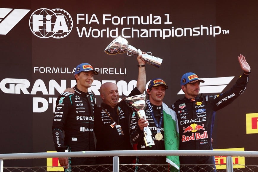 Formula One F1 - Italian Grand Prix - Autodromo Nazionale Monza, Monza, Italy - September 6, 2026
Mercedes' Andrea Kimi Antonelli celebrates on the podium with the trophy after winning the Italian Grand Prix alongside second placed Mercedes' George Russell and third placed Red Bull's Max Verstappen REUTERS/Jakub Porzycki