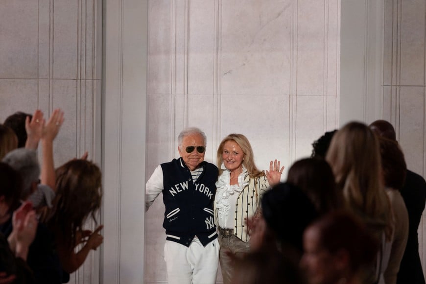 Designer Ralph Lauren and wife Ricky Lauren wave to applause after presenting creations from the latest Ralph Lauren collection in Manhattan, New York City, U.S., September 9, 2026. REUTERS/Caitlin Ochs