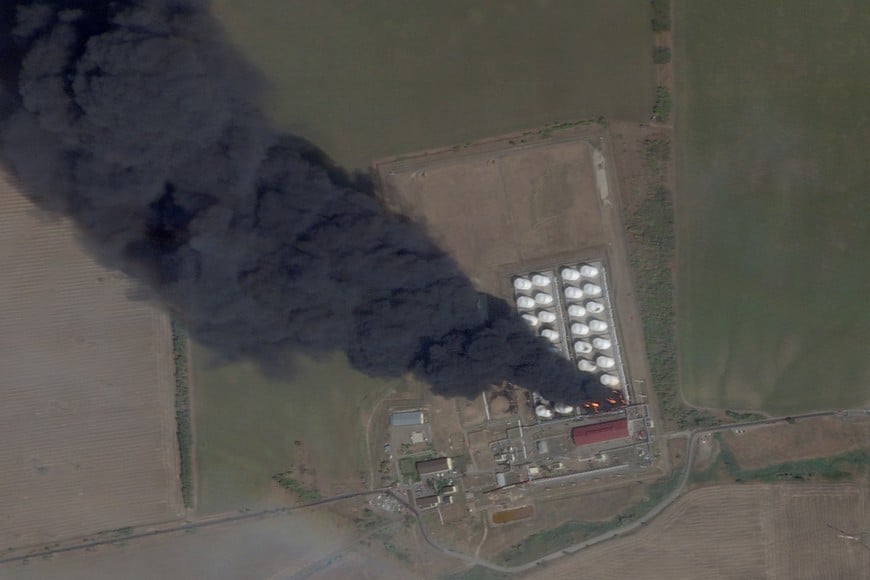 A satellite image shows smoke and fire rising from an oil depot, amid the ongoing conflict between Russia and Ukraine, at Astakhov in the Kamensky district, Rostov Region, Russia, August 28, 2024. 2024 Planet Labs Inc./Handout via REUTERS THIS IMAGE HAS BEEN SUPPLIED BY A THIRD PARTY. MANDATORY CREDIT.