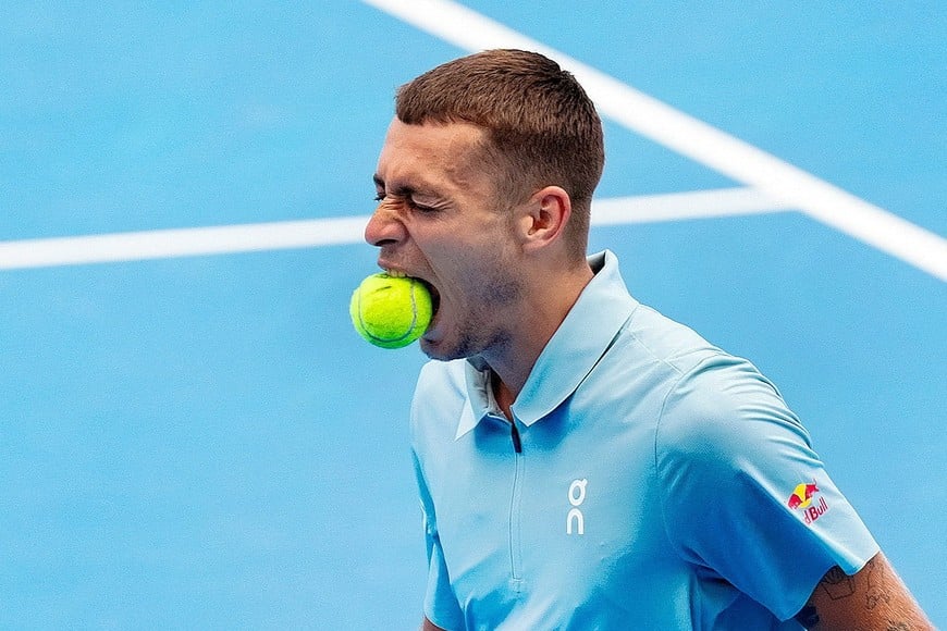 Aug 19, 2026; Mason, OH, USA; Flavio Cobolli (ITA) bites the ball as he reacts after returning a shot against Rafael Jodar (ESP) during the Cincinnati Open at Lindner Family Tennis Center. Mandatory Credit: Aaron Doster-Imagn Images TPX IMAGES OF THE DAY