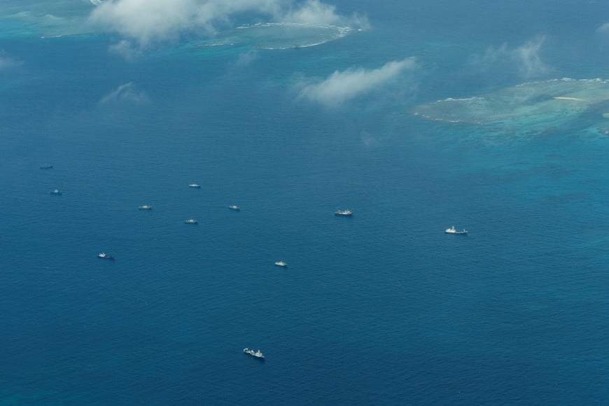 An aerial view of what Philippine Coast Guard alleges were Chinese vessels, manned by Chinese maritime militia loitering within the vicinity of Thitu Island, one of nine features occupied by the Philippines in Spratly Islands, in the disputed South China Sea, March 9, 2023.