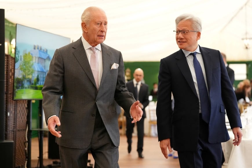 Britain's King Charles walks with Nvidia CEO Jensen Huang to a meeting for leaders from the artificial intelligence (AI) sector, Government, and thought leaders to discuss how AI can be developed and deployed in ways that benefit society, at Dumfries House in Cumnock, Britain, September 17, 2026. Jonathan Brady/Pool via REUTERS
