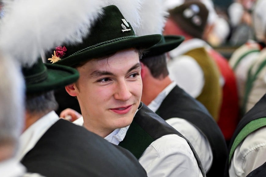 Attendees wearing traditional outfits enjoy the official opening day of the 191st Oktoberfest, the world's largest beer festival, in Munich, Germany, September 19, 2026. REUTERS/Fariha Farooqui