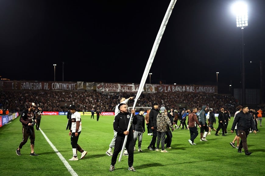Soccer Football - Copa Libertadores - Quarter Final - Second Leg - Platense v Fluminense - Estadio Ciudad de Vicente Lopez, Buenos Aires, Argentina - September 15, 2026
Platense fans invade the pitch after the match REUTERS/Agustin Marcarian