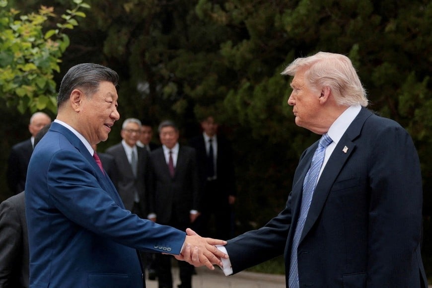 FILE PHOTO: U.S. President Donald Trump shakes hands with Chinese President Xi Jinping while leaving after a visit to the Zhongnanhai Garden in Beijing, China, May 15, 2026. REUTERS/Evan Vucci/Pool/File Photo