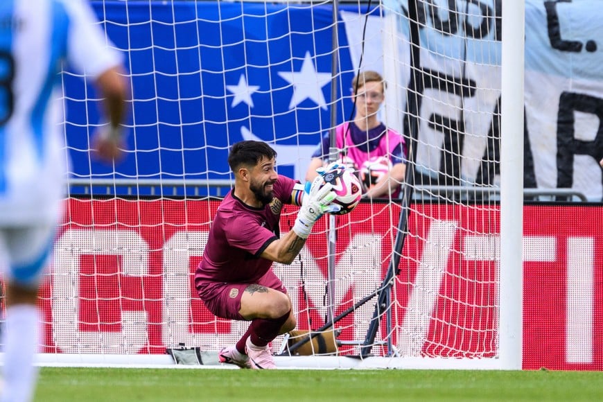 Jun 9, 2024; Chicago, Illinois, USA; Ecuador goalkeeper Hernan Galindez (1) makes a save against Argentina during the first half at Soldier Field. Mandatory Credit: Daniel Bartel-USA TODAY Sports