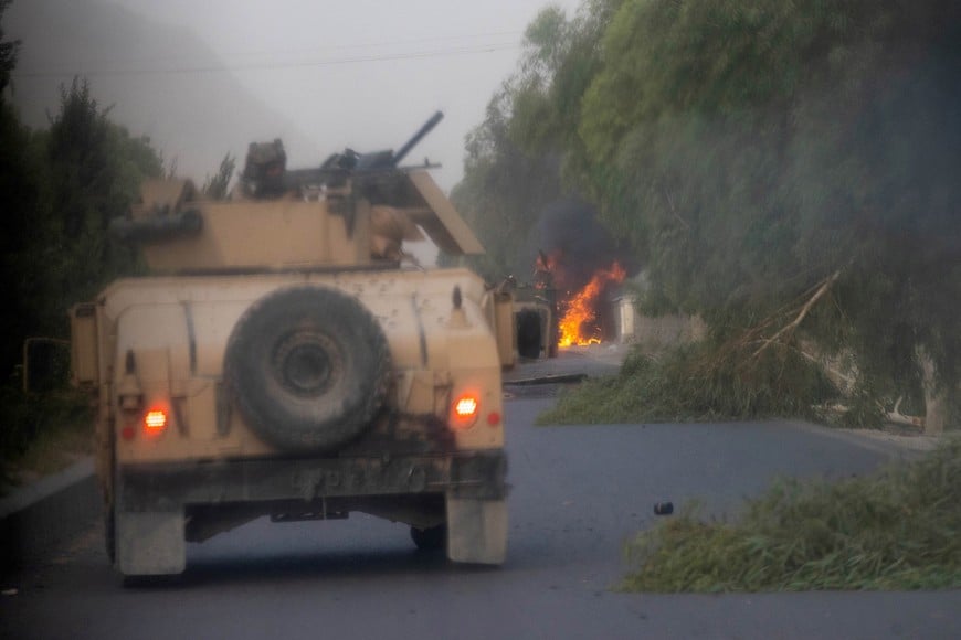 Humvees that belong to Afghan Special Forces are seen destroyed during heavy clashes with Taliban during the rescue mission of a police officer besieged at a check post, in Kandahar province, Afghanistan, July 13, 2021. REUTERS/Danish Siddiqui/File Photo TPX IMAGES OF THE DAY SEARCH "GLOBAL POY" FOR THIS STORY. SEARCH "REUTERS POY" FOR ALL BEST OF 2021 PACKAGES.