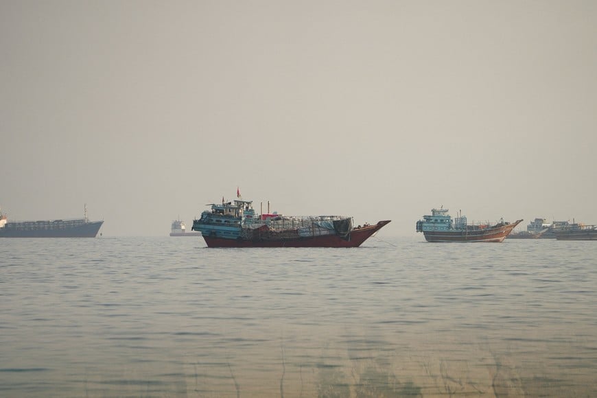 FILE PHOTO: Vessels at the Strait of Hormuz, as seen from Musandam, Oman, September 23, 2026. Picture taken through a window. REUTERS/Stringer/File Photo