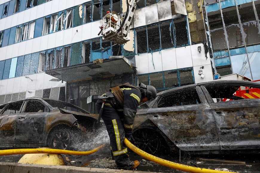 A firefighter works at the site of an office building hit by a Russian drone strike, amid Russia's attack on Ukraine, in Kyiv, Ukraine September 25, 2026. REUTERS/Valentyn Ogirenko