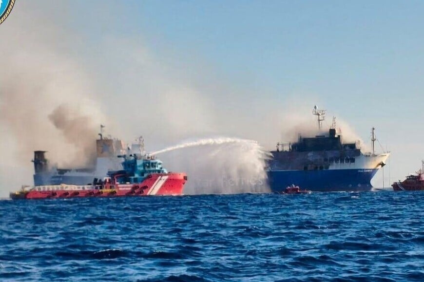 Firefighting vessel extinguishes which broke out at the Blue Carrier 2 vessel, off Mykonos, Greece, September 25, 2026. Hellenic Coast Guard/Handout via REUTERS THIS IMAGE HAS BEEN SUPPLIED BY A THIRD PARTY. OVERLAY FROM SOURCE.