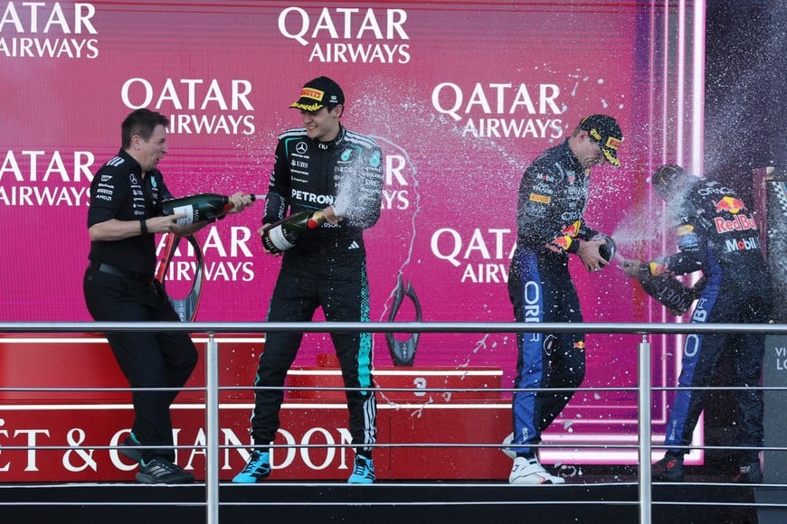 Formula One F1 - Azerbaijan Grand Prix - Baku City Circuit, Baku, Azerbaijan - September 26, 2026
Mercedes' George Russell celebrates on the podium after winning the race with second placed Red Bull's Max Verstappen and third placed Red Bull's Isack Hadjar REUTERS/Ramil Sitdikov