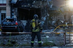 Firefighters work at the site of a cafe which was hit by a Russian drone strike, amid Russia's attack on Ukraine, in Kyiv, Ukraine September 28, 2026. REUTERS/Valentyn Ogirenko