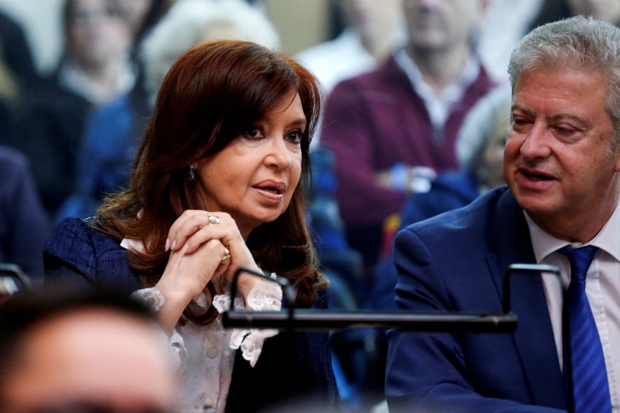 Former Argentine President Cristina Fernandez de Kirchner speaks to her lawyer, Carlos Beraldi, in a court room before the start of a corruption trial, in Buenos Aires, Argentina May 21, 2019. REUTERS/Agustin Marcarian