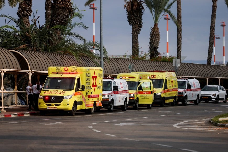 Ambulances wait at the Ben Gurion International Airport for the arrival of passengers from a FlyDubai aircraft bound for Israel from the United Arab Emirates, which was diverted to Saudi Arabia following an emergency signal, in Lod, near Tel Aviv, Israel, September 30, 2026. REUTERS/Ammar Awad