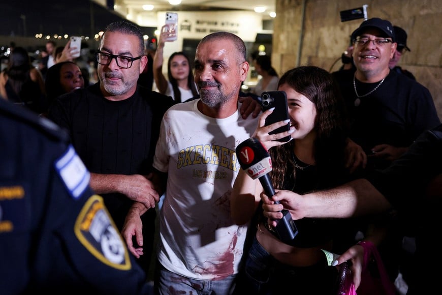 Yaniv Hayun, one of the men who helped incapacitate the attacker on the FlyDubai aircraft bound for Israel from the United Arab Emirates, which was diverted to Saudi Arabia following an emergency signal, reacts after arriving at the Ben Gurion International Airport, in Lod, near Tel Aviv, Israel, September 30, 2026. REUTERS/Ammar Awad TPX IMAGES OF THE DAY