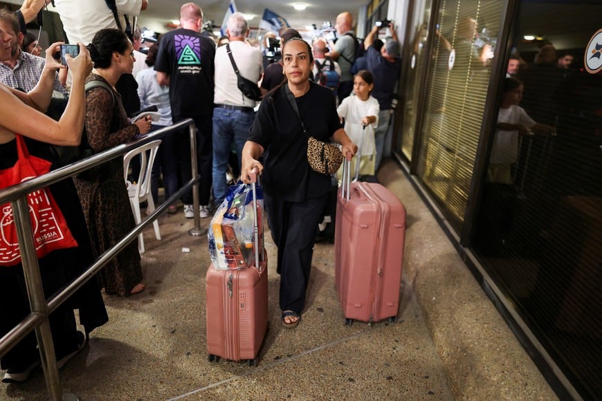 Passengers who were on the FlyDubai aircraft bound for Israel from the United Arab Emirates, which was diverted to Saudi Arabia following an emergency signal, arrive at the Ben Gurion International Airport, in Lod, near Tel Aviv, Israel, September 30, 2026. REUTERS/Ammar Awad