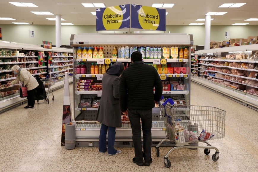FILE PHOTO: Clubcard price branding inside a branch of a Tesco Extra Supermarket in London, Britain, February 10, 2022. REUTERS/Paul Childs/File Photo