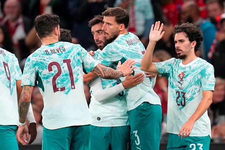 Soccer Football - UEFA Nations League - Group A4 - Denmark v Portugal - Parken, Copenhagen, Denmark - October 1, 2026
Portugal's Bruno Fernandes and Ruben Dias celebrate a goal
Liselotte Sabroe/Ritzau Scanpix via REUTERS    

ATTENTION EDITORS - THIS IMAGE WAS PROVIDED BY A THIRD PARTY. DENMARK OUT. NO COMMERCIAL OR EDITORIAL SALES IN DENMARK.