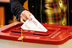 A person casts their vote during the general election in Riga, Latvia, October 3, 2026. REUTERS/Ints Kalnins