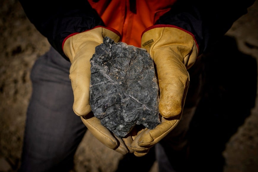 FILE PHOTO: A person holds a rock sample at Anglo American's Los Bronces copper mine in Chile, obtained by Reuters on April 26, 2024. Anglo American/Handout via REUTERS/File Photo