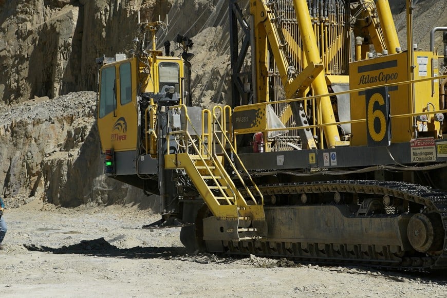 A worker walks near a drill rig in a pit at Anglo American's Los Bronces copper mine in Chile, obtained by Reuters on April 26, 2024. Anglo American/Handout via REUTERS THIS IMAGE HAS BEEN SUPPLIED BY A THIRD PARTY.