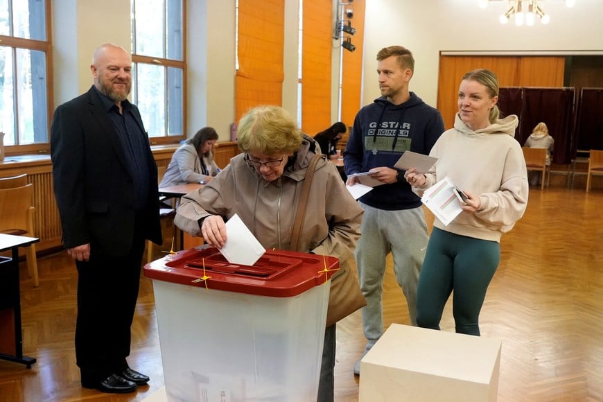 People vote during the general election in Riga, Latvia, October 3, 2026. REUTERS/Ints Kalnins