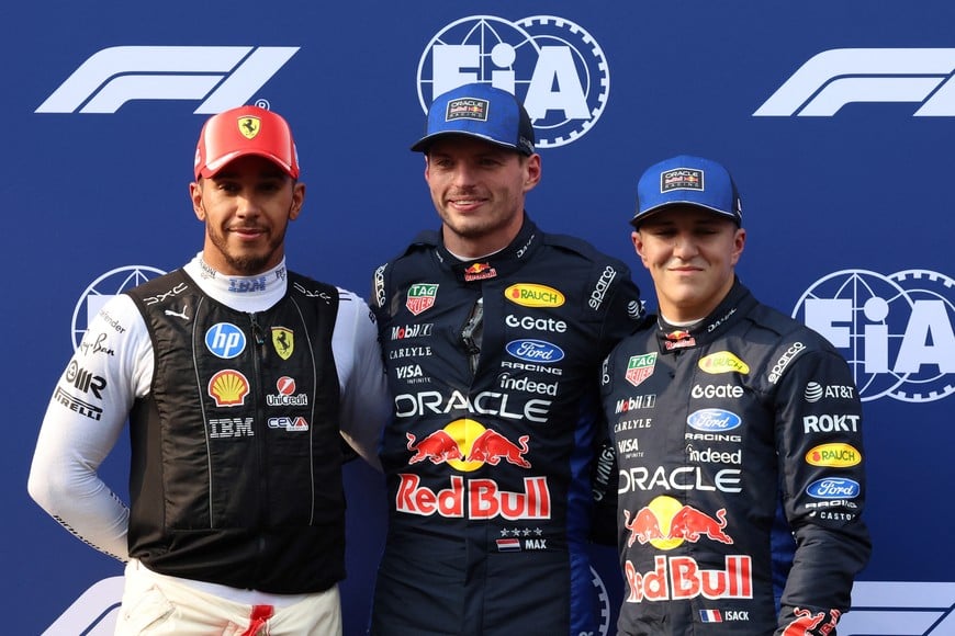 Formula One F1 - Bahrain Grand Prix - Sepang International Circuit, Sepang, Malaysia - October 3, 2026
Red Bull's Max Verstappen celebrates after qualifying in pole position with second placed Ferrari's Lewis Hamilton and third placed Red Bull's Isack Hadjar REUTERS/Annice Lyn/Pool