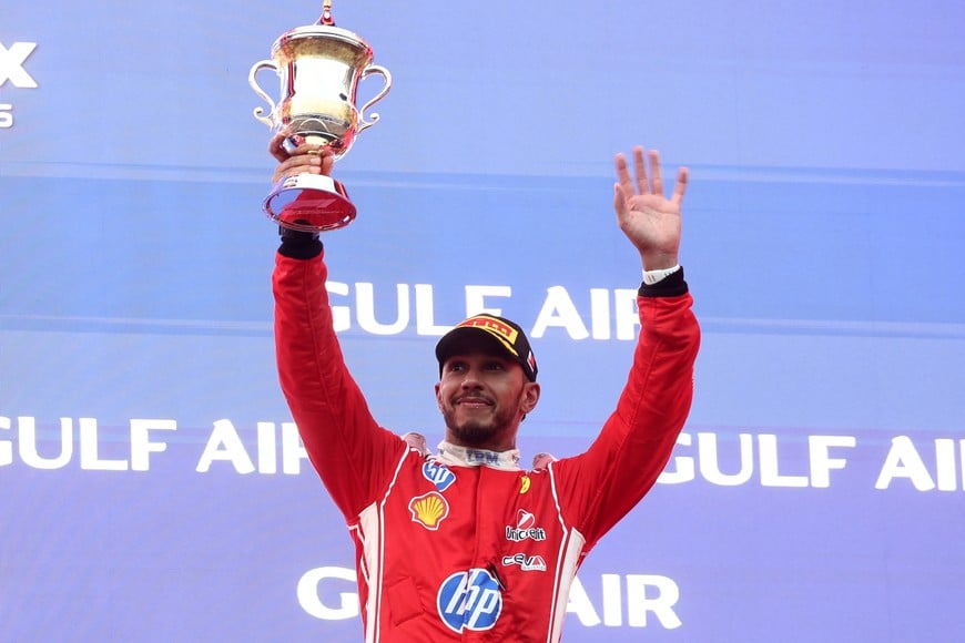 Formula One F1 - Bahrain Grand Prix - Sepang International Circuit, Sepang, Malaysia - October 4, 2026
Ferrari's Lewis Hamilton celebrates with his trophy on the podium after finishing third in the Bahrain Grand Prix REUTERS/Jakub Porzycki