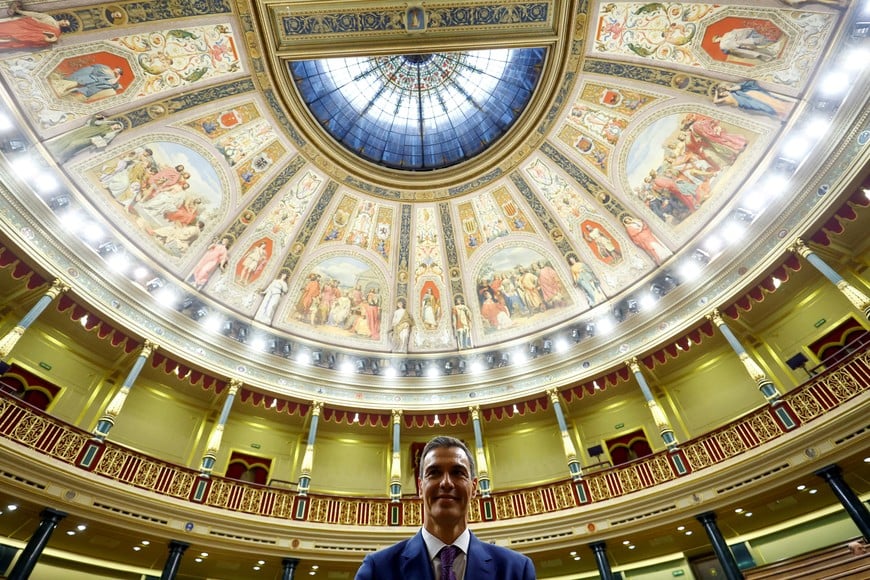 FILE PHOTO: Spain's newly re-appointed Prime Minister Pedro Sanchez reacts after the voting at the investiture debate, as Spain's Socialists clinched a new term following a deal with the Catalan separatist Junts party for support, in Madrid, Spain November 16, 2023. REUTERS/Susana Vera/File Photo