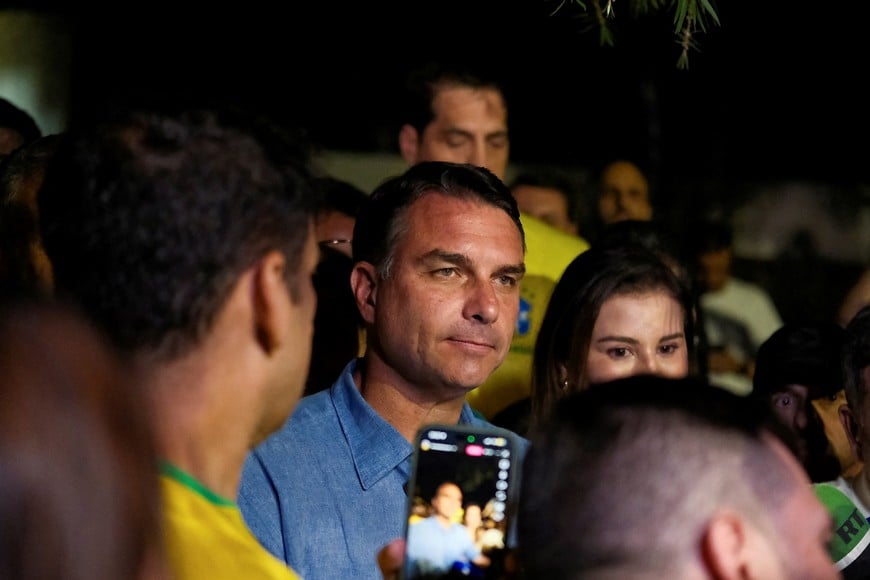 Brazil's presidential candidate Flavio Bolsonaro of the Liberal Party (PL) reacts after the country's electoral authority said he will face President Luiz Inacio Lula da Silva in the runoff of a presidential election, in Brasilia, Brazil, October 4, 2026. REUTERS/Diego Herculano