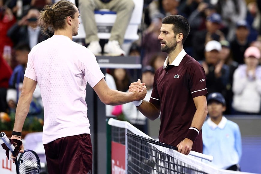 Tennis - China Open - National Tennis Center, Beijing, China - October 4, 2026
Serbia's Novak Djokovic shakes hands with Germany's Alexander Zverev after winning their quarterfinal match REUTERS/Tingshu Wang