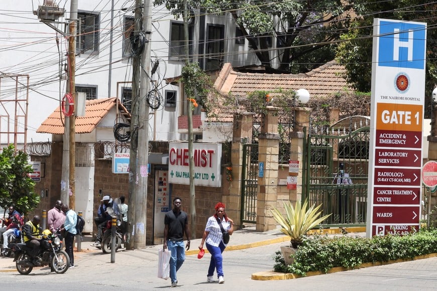 People walk outside the Nairobi Hospital where the first Ebola patient had been admitted before he died in Nairobi, Kenya, October 6, 2026. REUTERS/Monicah Mwangi TPX IMAGES OF THE DAY