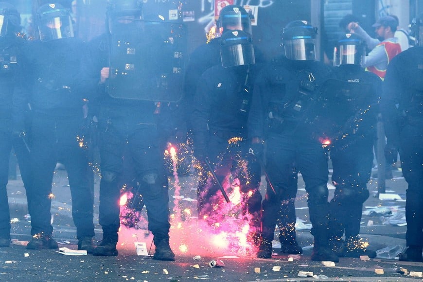 REFILE - CORRECTING PHOTOGRAPHER NAME
Fireworks explode near French CRS riot police amid clashes with protesters during a demonstration by high school and university students, supported by teachers' union and school parents, in Paris as part of a nationwide day of protests and blockades, voicing anger over overcrowded classrooms, teacher shortages and dilapidated school buildings, which students blame on years of underinvestment, France, October 6, 2026. REUTERS/Yves Herman