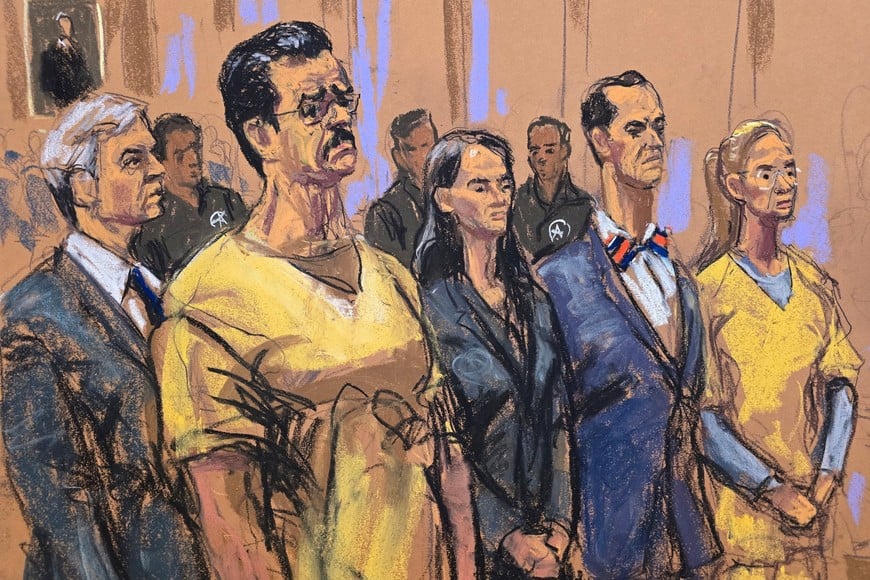 Ousted Venezuelan President Nicolas Maduro and his wife, Cilia Flores, stand with Maduro's lawyers Barry Pollack and Anna Estevao and Flores' lawyer, Mark Donnelly, at a hearing before U.S. District Judge Alvin Hellerstein, who set a trial date of June 1, 2027 to face U.S. drug trafficking charges at the Daniel Patrick Moynihan United States Court House in New York City, U.S., July 22, 2026 in this courtroom sketch. REUTERS/Jane Rosenberg     TPX IMAGES OF THE DAY