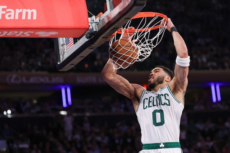 May 12, 2025; New York, New York, USA; Boston Celtics forward Jayson Tatum (0) dunks the ball in the second half during game four of the second round for the 2025 NBA Playoffs against the New York Knicks at Madison Square Garden. Mandatory Credit: Vincent Carchietta-Imagn Images