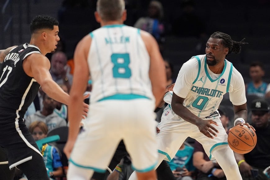 Oct 6, 2026; Charlotte, North Carolina, USA;  Charlotte Hornets center Naz Reid (0) handles the ball against the Brooklyn Nets during the first quarter at Spectrum Center.  Mandatory Credit: Jim Dedmon-Imagn Images