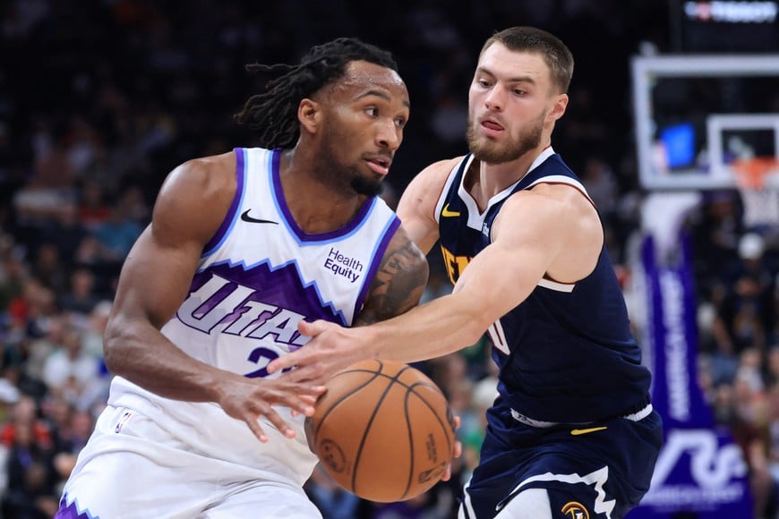 Oct 6, 2026; Salt Lake City, Utah, USA;  Utah Jazz guard Darryn Peterson (22) and the ball knocked away by Denver Nuggets guard Christian Braun (0) during the second quarter at Delta Center.  Mandatory Credit: Rob Gray-Imagn Images
