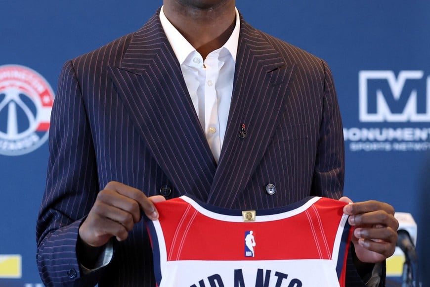 Jun 25, 2026; Washington, DC, USA; Washington Wizards first round draft pick and number one overall pick AJ Dybantsa poses for a photo with his jersey during a press conference at InterContinental Hotel. Mandatory Credit: Amber Searls-Imagn Images