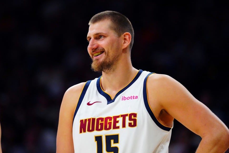 Oct 4, 2026; Boulder, Colorado, USA;  Denver Nuggets center Nikola Jokic (15) reacts in the second quarter against the Utah Jazz at CU Events Center.  Mandatory Credit: Ron Chenoy-Imagn Images