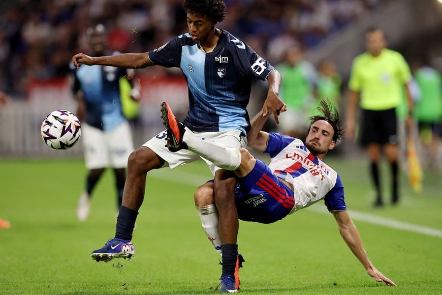 Soccer Football - Ligue 1 - Olympique Lyonnais v Le Havre AC - Groupama Stadium, Lyon, France - August 29, 2026
Olympique Lyonnais' Djibril Ouziad in action with Le Havre AC's Nicolas Tagliafico REUTERS/Manon Cruz