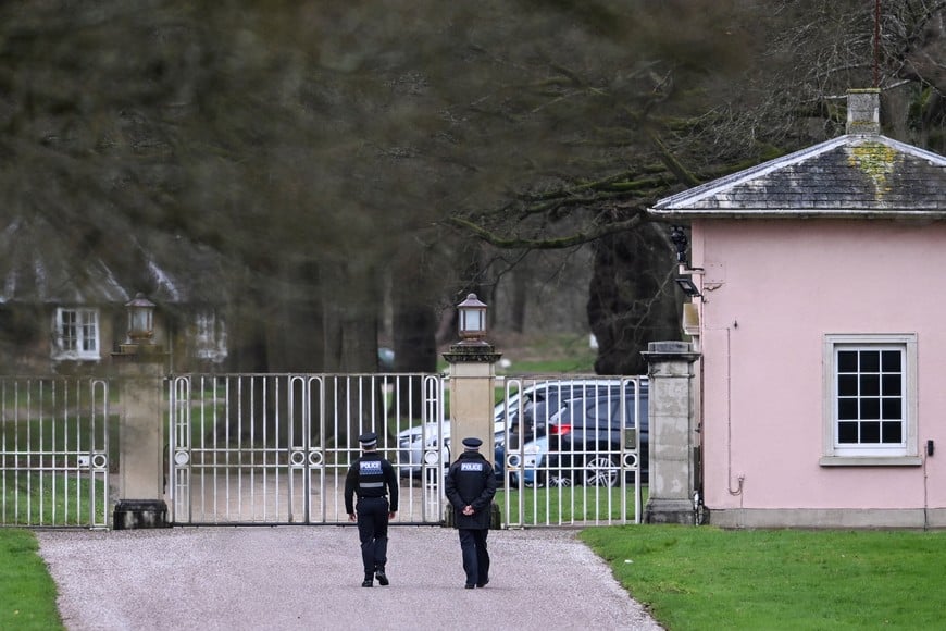 Police officers at the entrance of the Royal Lodge, a property on the estate surrounding Windsor Castle and a former residence of Andrew Mountbatten-Windsor, younger brother of Britain's King Charles, formerly known as Prince Andrew, a day after Andrew Mountbatten-Windsor was released following arrest on suspicion of misconduct in public office, after the U.S. Justice Department released more records tied to the late financier and convicted sex offender Jeffrey Epstein, in Windsor, Britain, February 20, 2026. REUTERS/Jaimi Joy